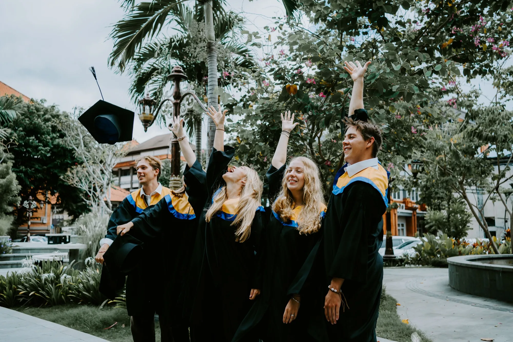 Graduates throwing their caps