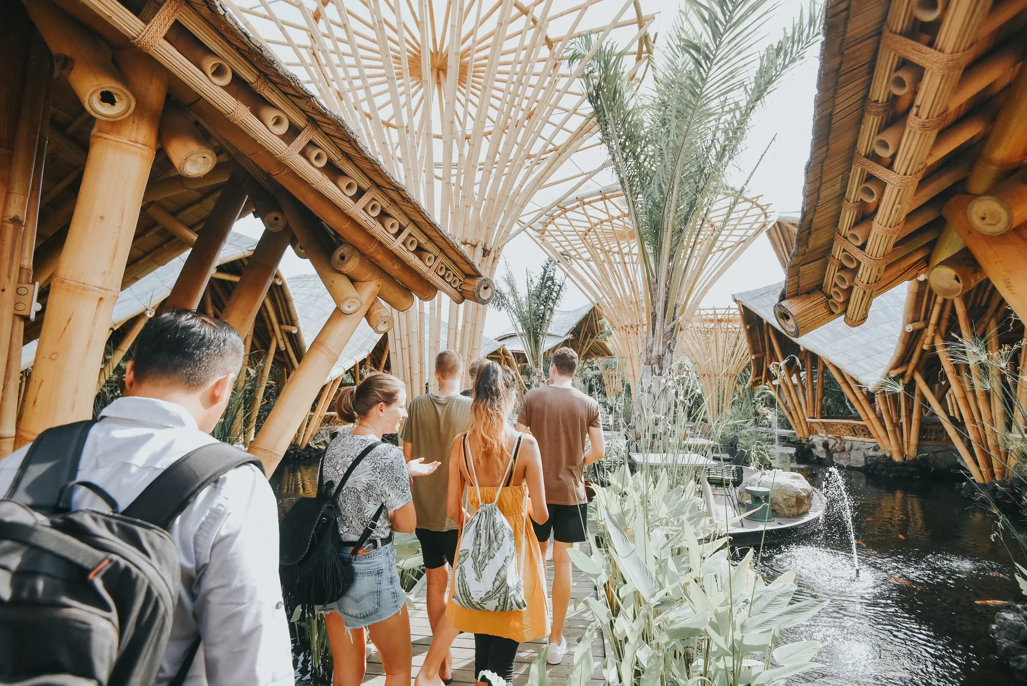 Summer School students walking through the bamboo architecture at Wanaku, Bali